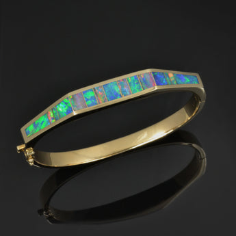 Natural opal inlay bracelet in 14k gold by Hileman.