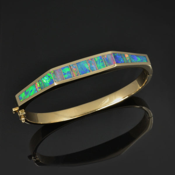 Natural opal inlay bracelet in 14k gold by Hileman.