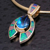 Australian opal pendant with a fantasy cut blue topaz and diamonds set in 14k gold