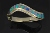 Large curved Australian opal bracelet with diamonds.