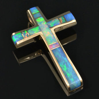 Australian opal cross pendant in 14k gold by Hileman