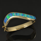 Curved channel opal bracelet in 14k gold by The Hileman Collection.