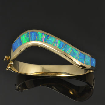 Australian Opal bracelet with top quality opal inlaid in 14k yellow gold.
