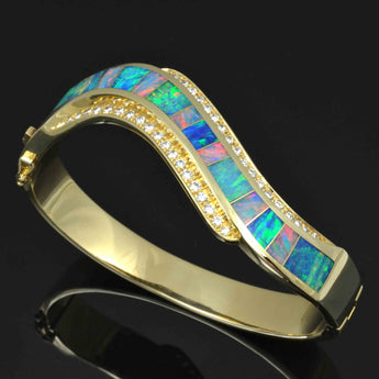 Australian opal bracelet with diamond accents in 14k gold by The Hileman Collection.
