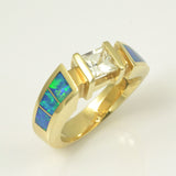 White sapphire and opal ring in 14k gold.