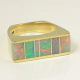 Flat top opal ring in yellow gold.