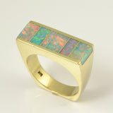 Flat top opal inlay ring in 14k gold.