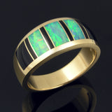 Man's black onyx and opal wedding ring in 14k yellow gold.