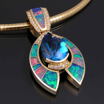Opal and diamond pendant with fantasy cut topaz set in 14k gold